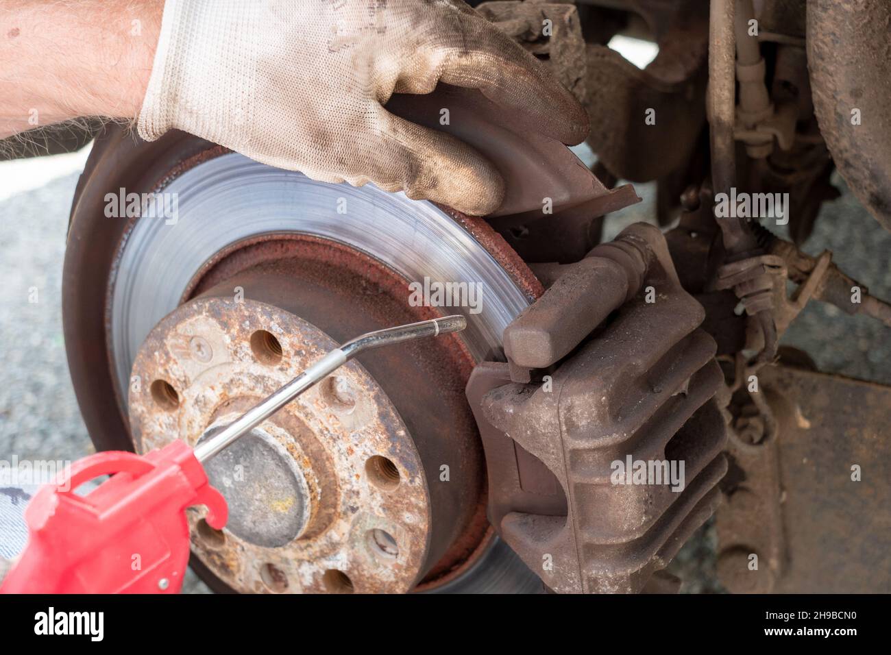 Auto mechanic working on brakes hi-res stock photography and images - Alamy