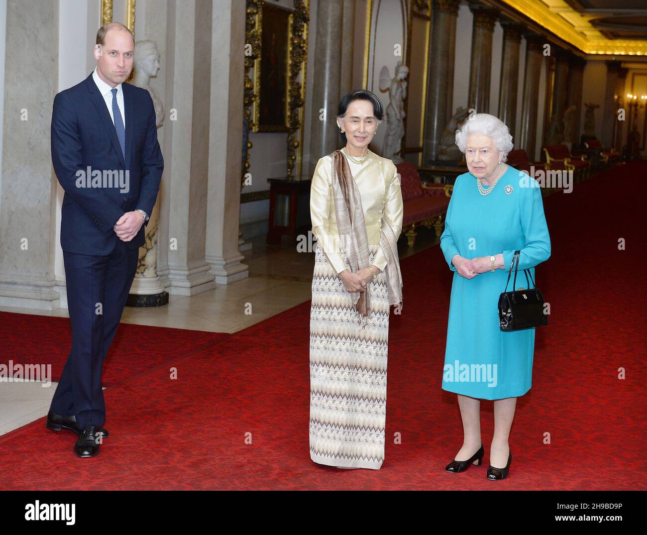 File photo dated 5/5/2017 of Queen Elizabeth II and the Duke of Cambridge greeting Burma's then de facto leader Aung San Suu Kyi ahead of a private lunch at Buckingham Palace in London. A court in Myanmar has sentenced the country's ousted leader, Aung San Suu Kyi, to four years in prison after finding her guilty of incitement and violating coronavirus restrictions, a legal official said. Issue date: Monday December 6, 2021. Stock Photo