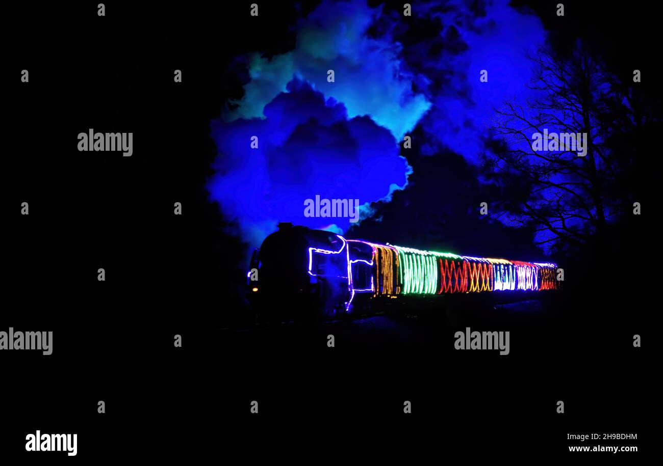 Christmas train at night lit up Stock Photo