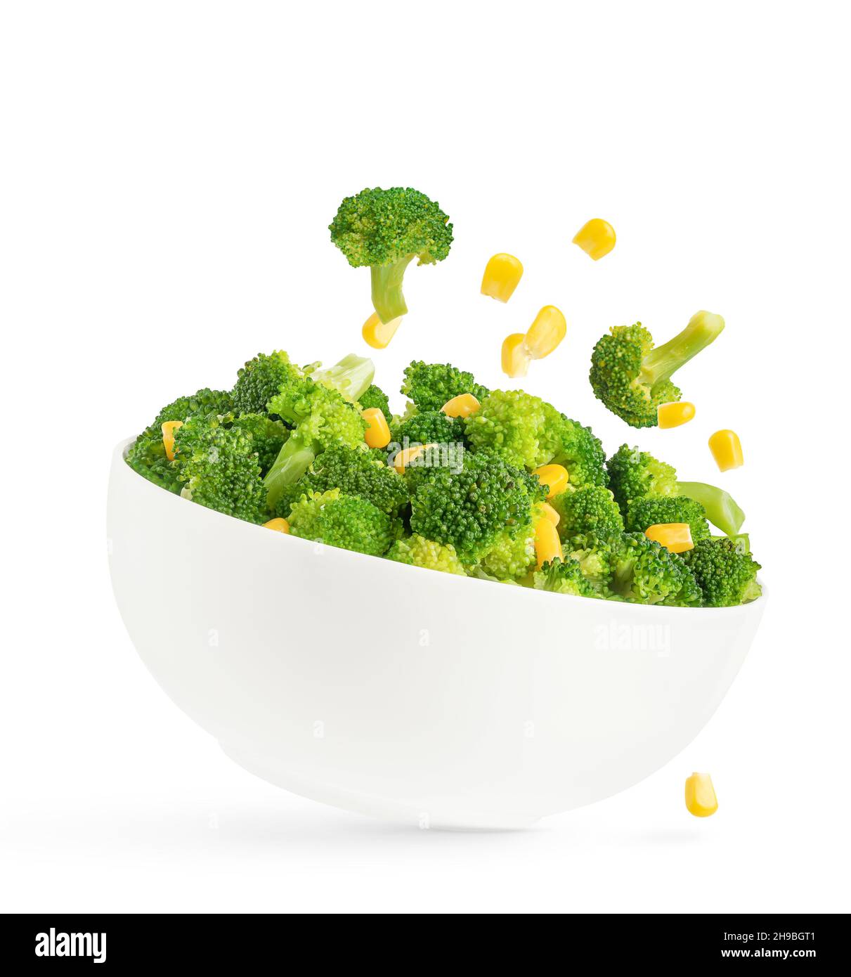 Broccoli salad bowl with flying ingredients isolated on white ...