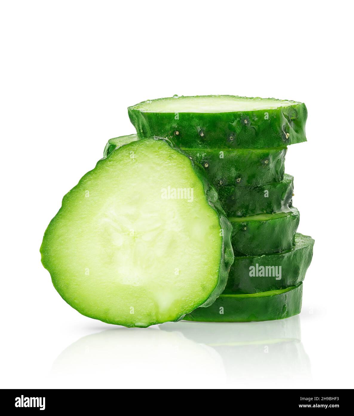 Stack of sliced cucumber isolated on white background with clipping path. Stock Photo