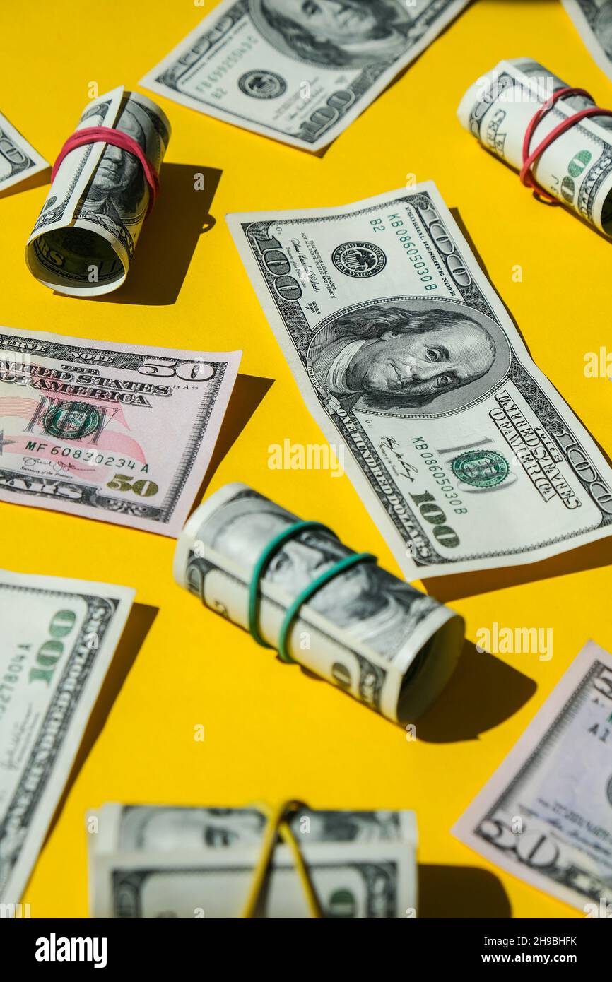 US dollars bundle close up isolated on dollar background. Paper