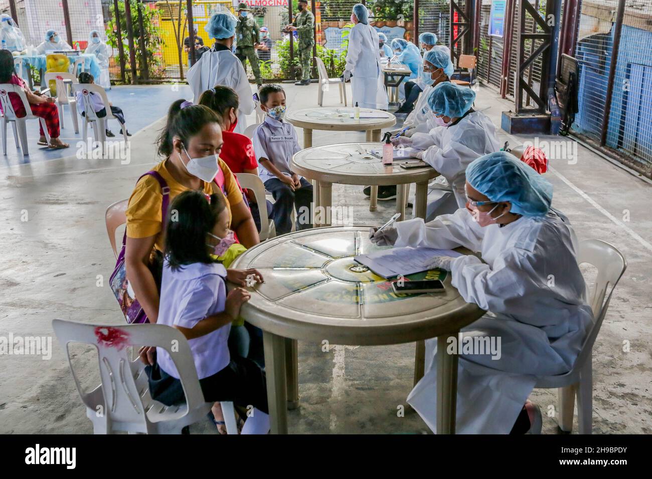 Quezon City, Philippines. 6th Dec, 2021. Students wearing protective