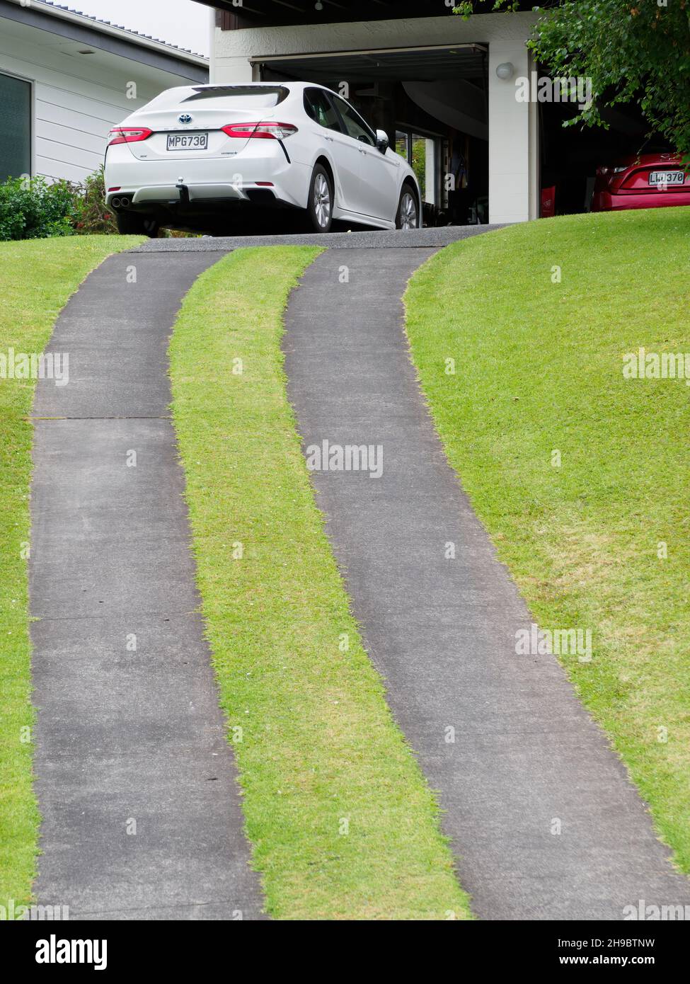 AUCKLAND, NEW ZEALAND Dec 01, 2021 White car at the top of driveway