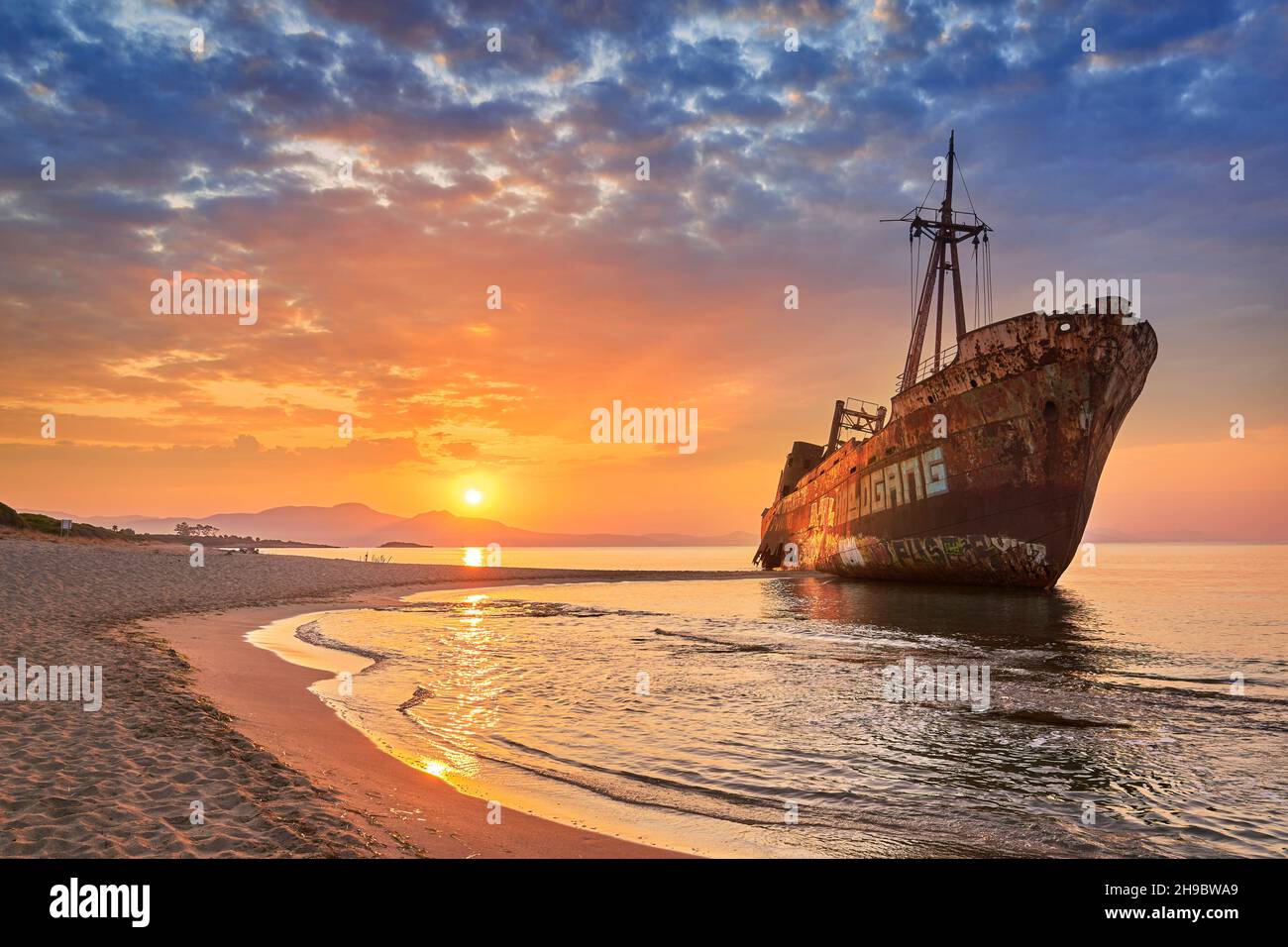 Shipwreck at sunrise, Glyfada Beach near Gytheio, Peloponnese, Greece Stock Photo