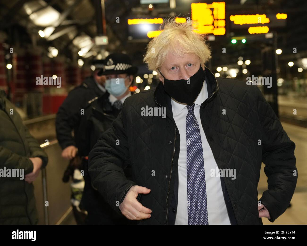 British Prime Minister Boris Johnson talks to British Transport Police officers at Liverpool Lime Street station as part of 'Operation Toxic' to infiltrate County Lines drug dealings, ahead of the publication of the government's 10-year drug strategy. Picture date: Monday December 6, 2021. Stock Photo