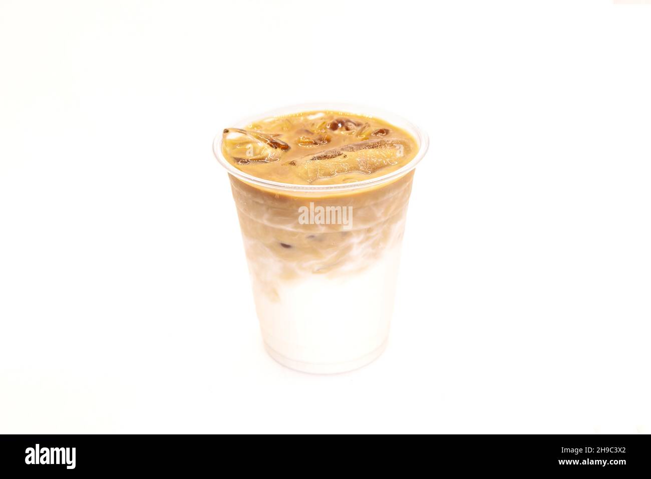 Iced latte or iced coffee in takeaway cup on white background