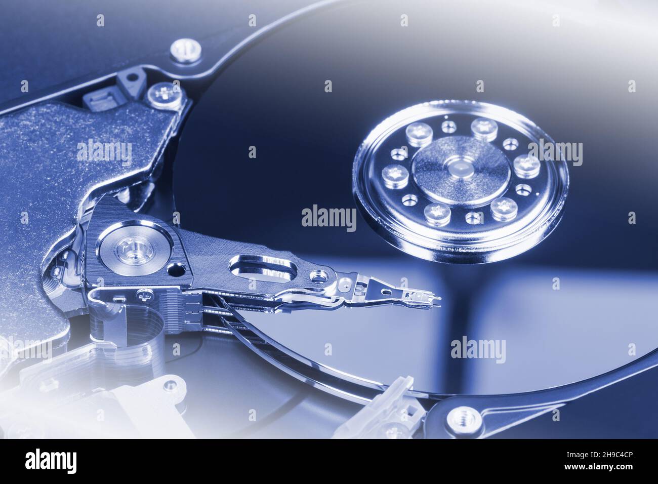 Magnetic head above the surface of the hard drive. Internal hard disk device Stock Photo