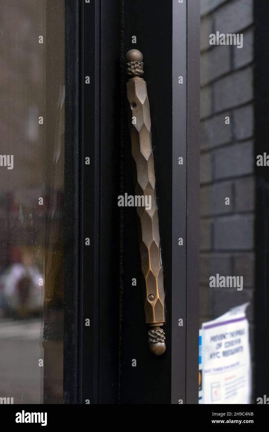 A long ornate mezuzah on the doorpost of Satmar Meats on Lee Avenue in Williamsburg, Brooklyn, New York City. Stock Photo