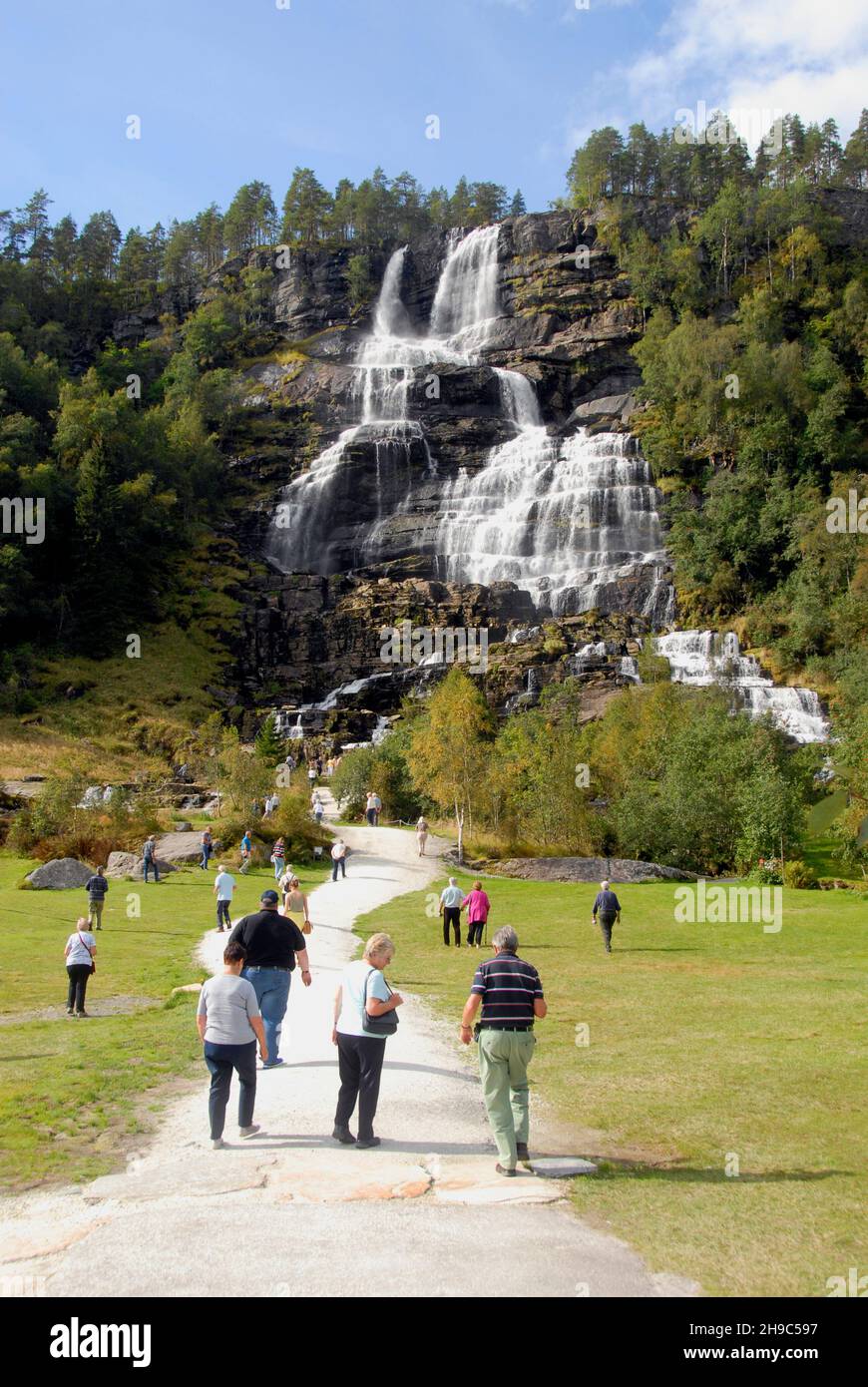 Tourists flocking to see the Tvindefossen Waterfall, Norway Stock Photo