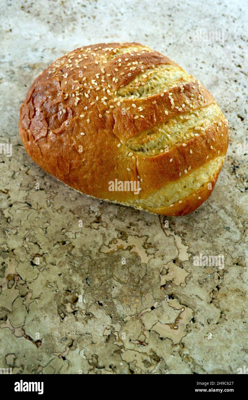 A loaf of stone baked bread on the tabletone Stock Photo Alamy