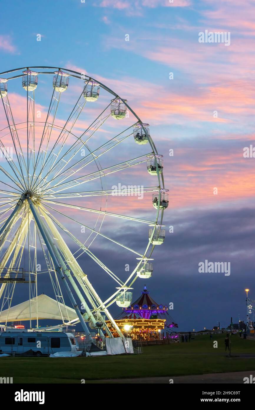 A beautiful sunset sky with a ferris wheel partially included Stock ...
