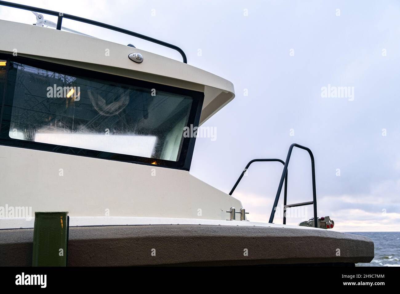 The boat is mounted on a mounting bracket, secured with safety belts