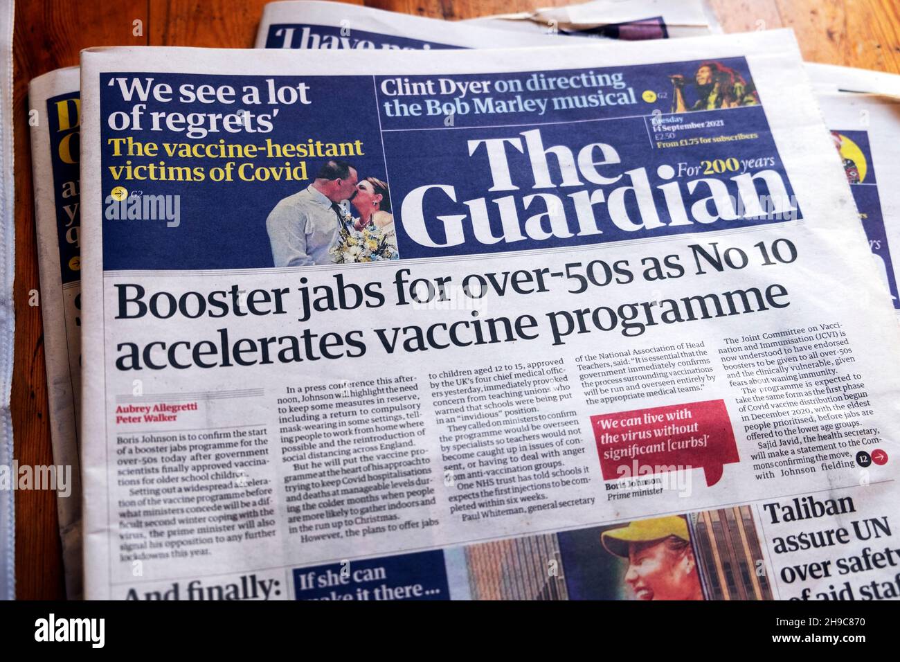 'Booster jabs for over-50s as No 10 accelerates vaccine programme' Guardian covid 19 newspaper headline front page on 14 September 2021 London UK Stock Photo