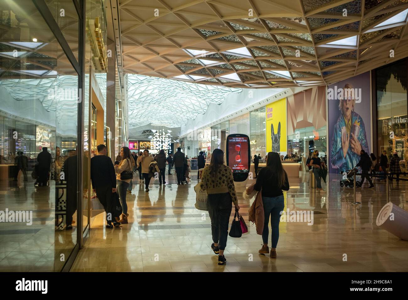 LONDON- December 2021:  Shoppers inside Westfield London- large shopping centre in Shepherds Bush Stock Photo
