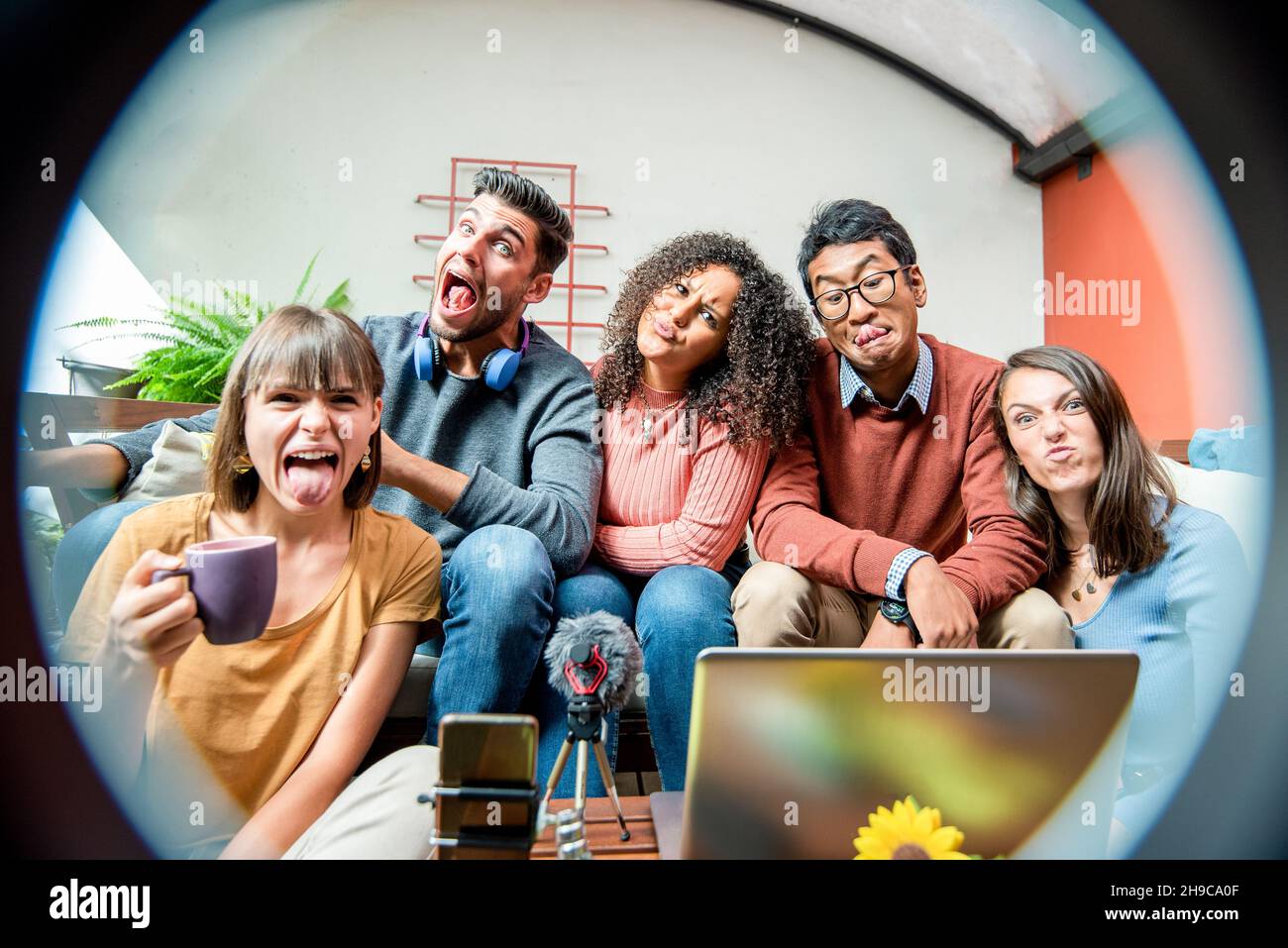 Happy young smart bloggers filming new vlog video with smartphone, ring ...