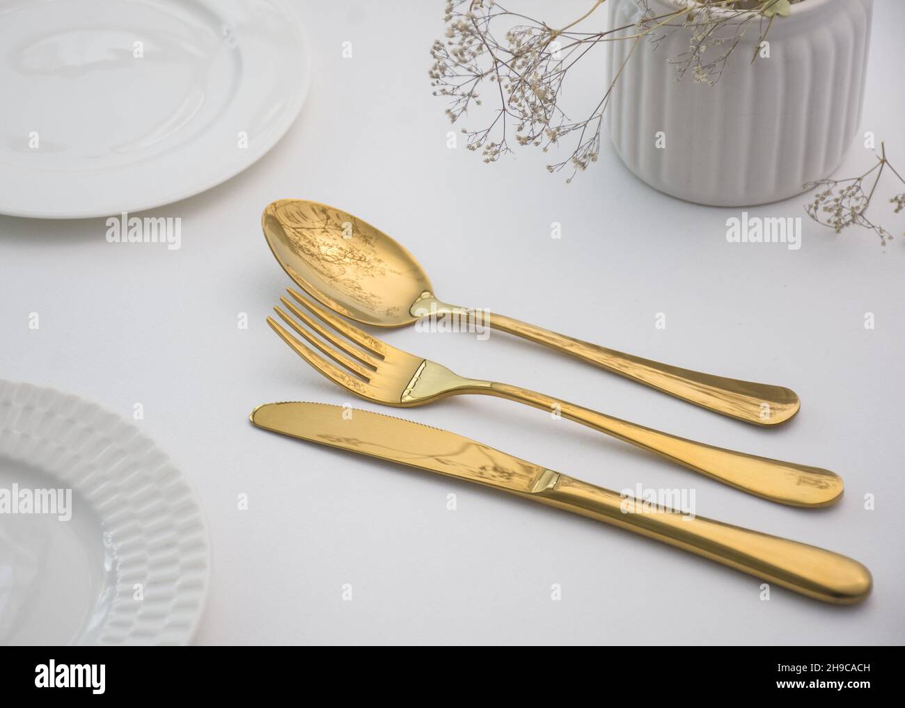 gold cutlery service Stock Photo Alamy