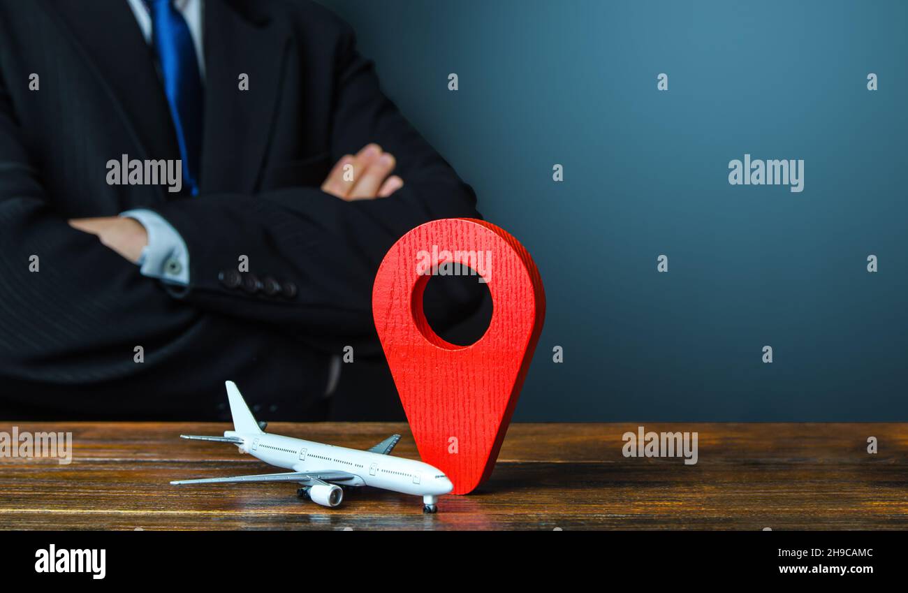 Passenger plane and red location pin map icon. Organization of air traffic. Quarantines and Pandemic Restrictions. Business class flights. Support fin Stock Photo