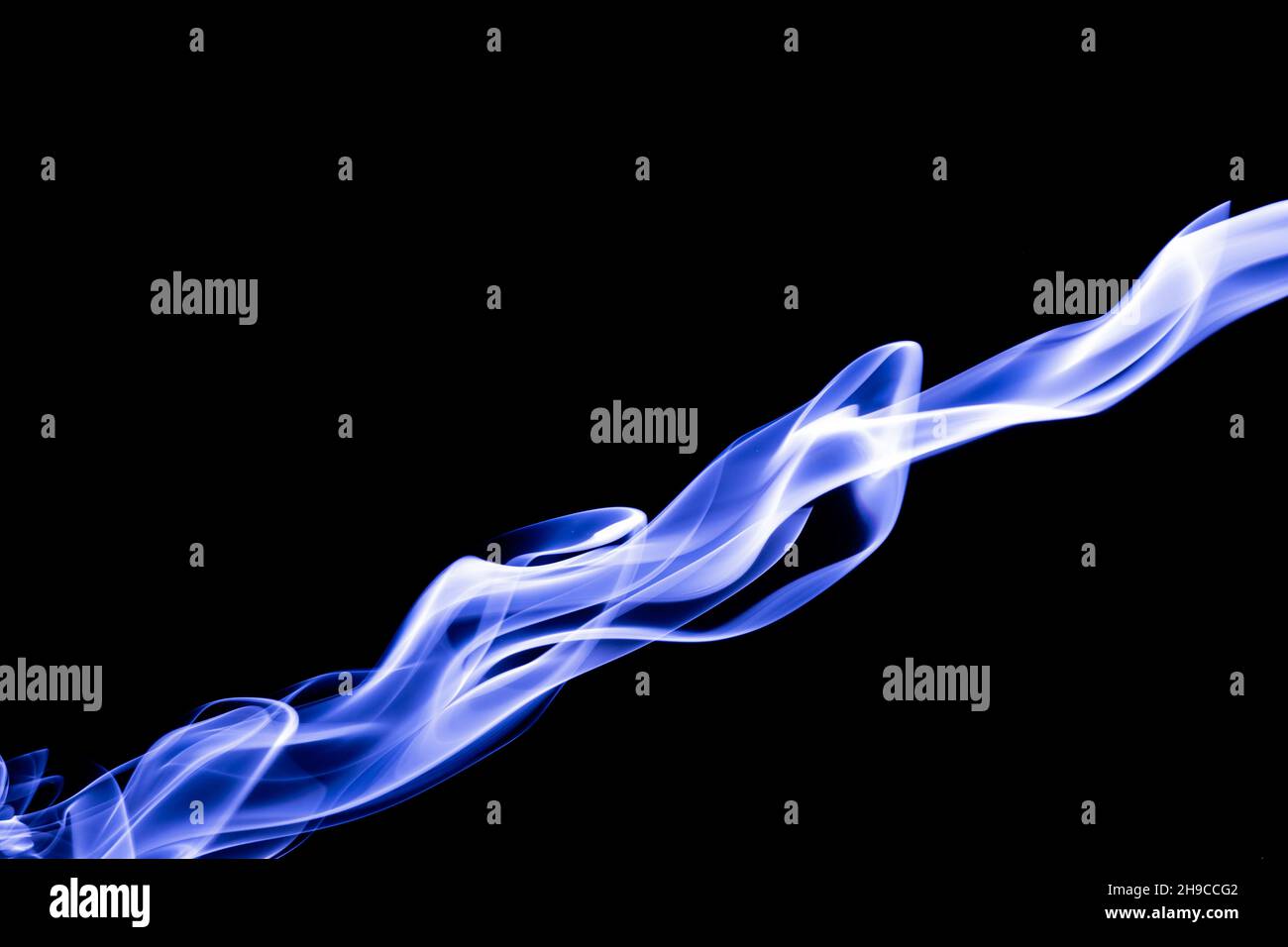 Blue color abstract smoke on black background Stock Photo - Alamy