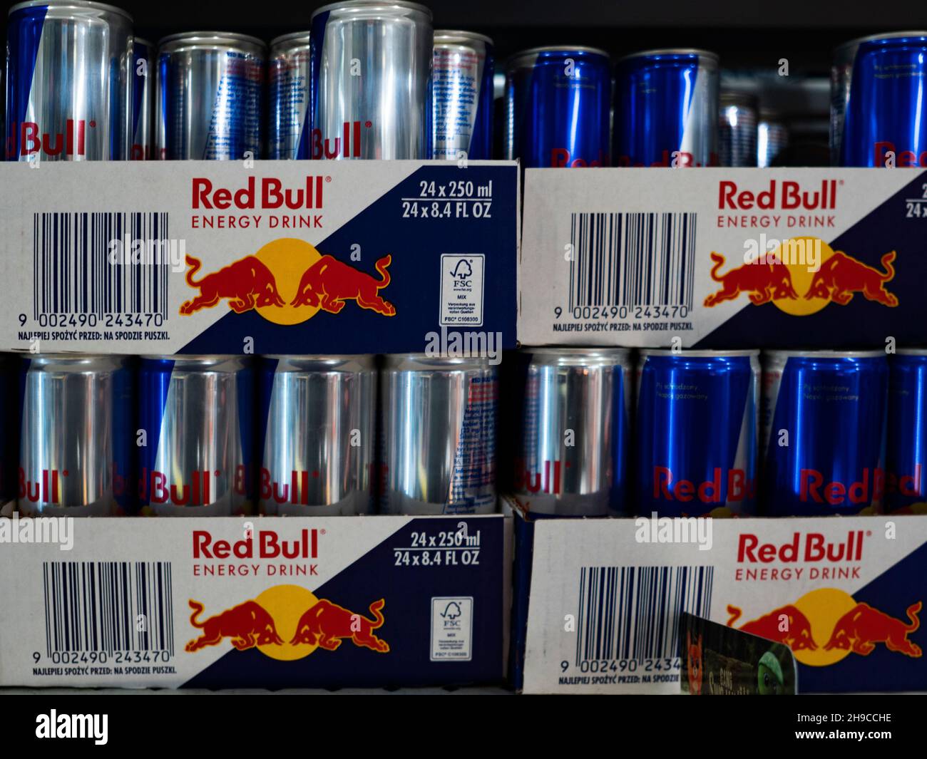 Boxes of Aluminium can of Red Bull Energy drink in the store. Red Bull is the most popular energy drink in the world Stock Photo