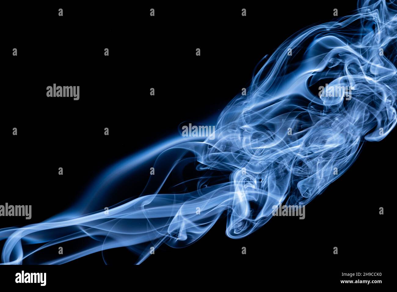 Blue color abstract smoke on black background Stock Photo - Alamy
