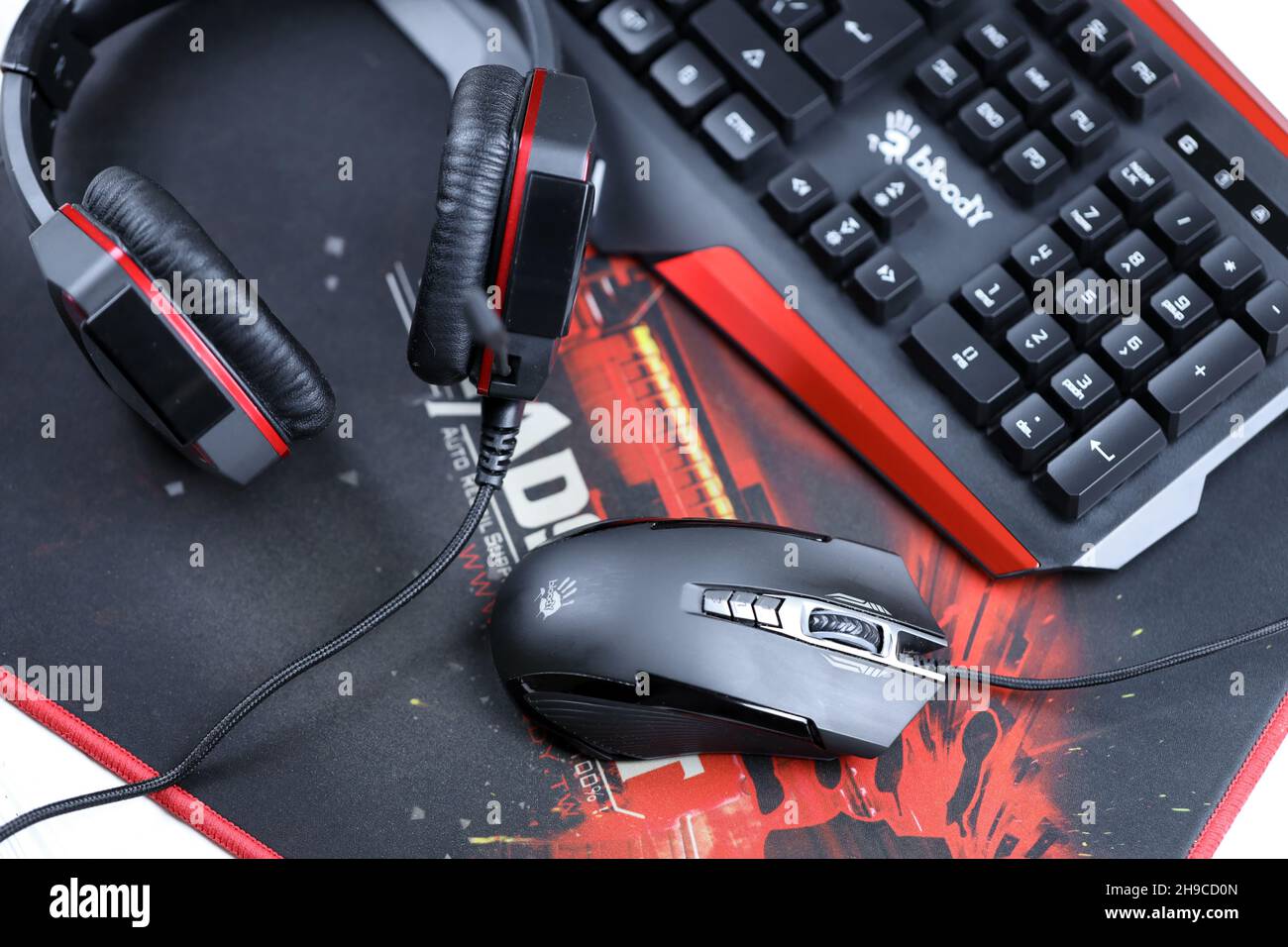 KHARKOV, UKRAINE - MARCH 14, 2021: A4tech bloody B3590R gaming keyboard, G501  headset and P93 optical mouse on B-070 Headshot surface in red and black  Stock Photo - Alamy