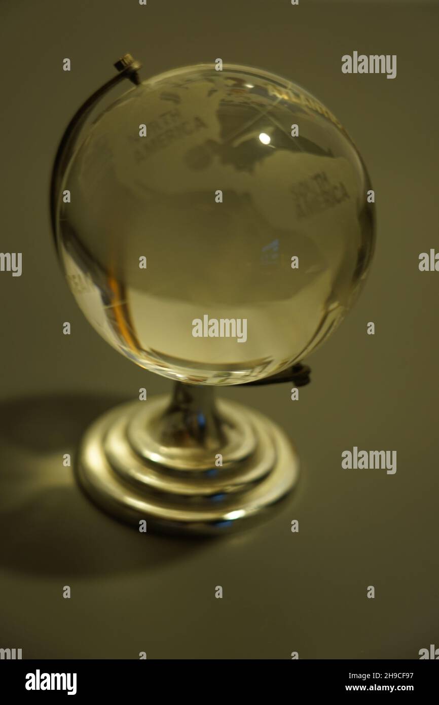 glass globe in the world of the bedside lamp Stock Photo Alamy