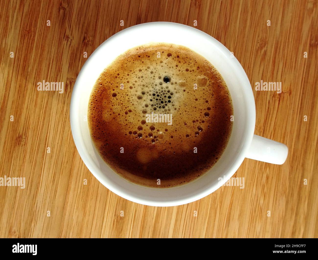 Cup of coffee, top view, wooden table Stock Photo