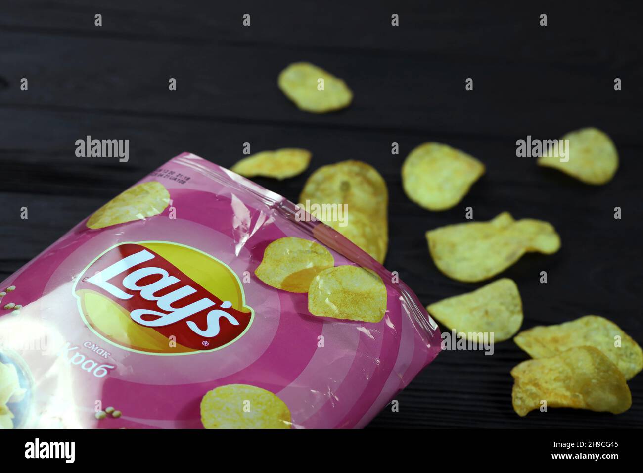 KHARKOV, UKRAINE - JANUARY 3, 2021: Lays potato chips with crab flavour and original lays logo in middle of package. Worldwide famous brand of potato Stock Photo