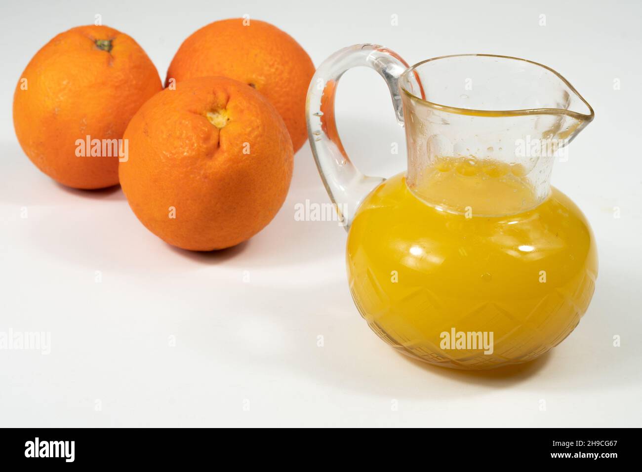 glass carafe with freshly squeezed orange juice Stock Photo Alamy
