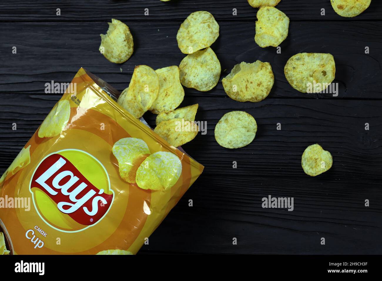 KHARKOV, UKRAINE - JANUARY 3, 2021: Lays potato chips with cheese flavour and original lays logo in middle of package. Worldwide famous brand of potat Stock Photo