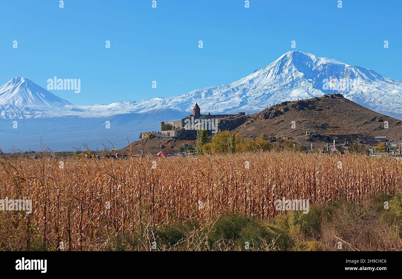 Stunning view from a fiel in front of Khor Virap an Armenian monastery and the Ararat peak in Armenia Stock Photo