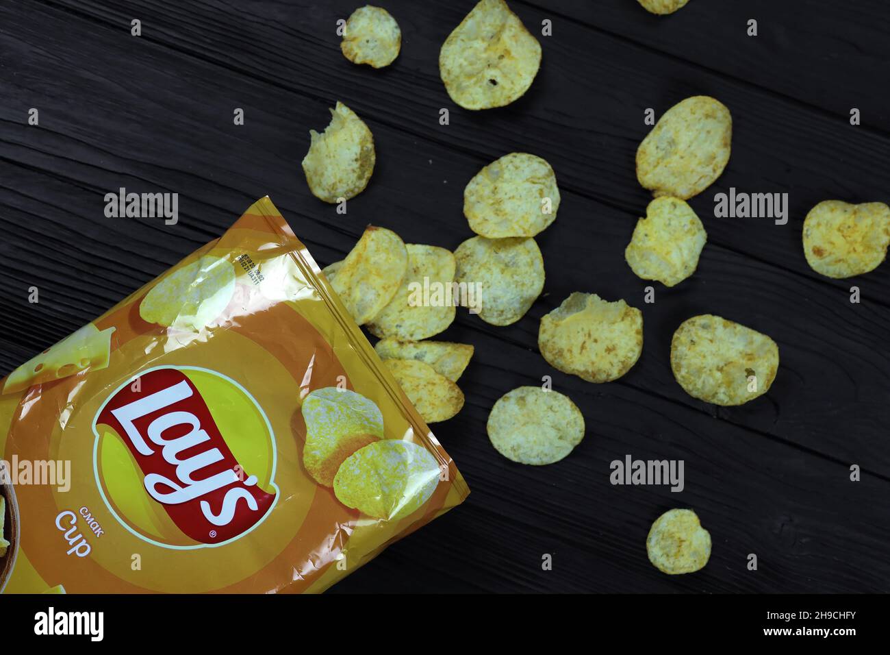 KHARKOV, UKRAINE - JANUARY 3, 2021: Lays potato chips with cheese flavour and original lays logo in middle of package. Worldwide famous brand of potat Stock Photo