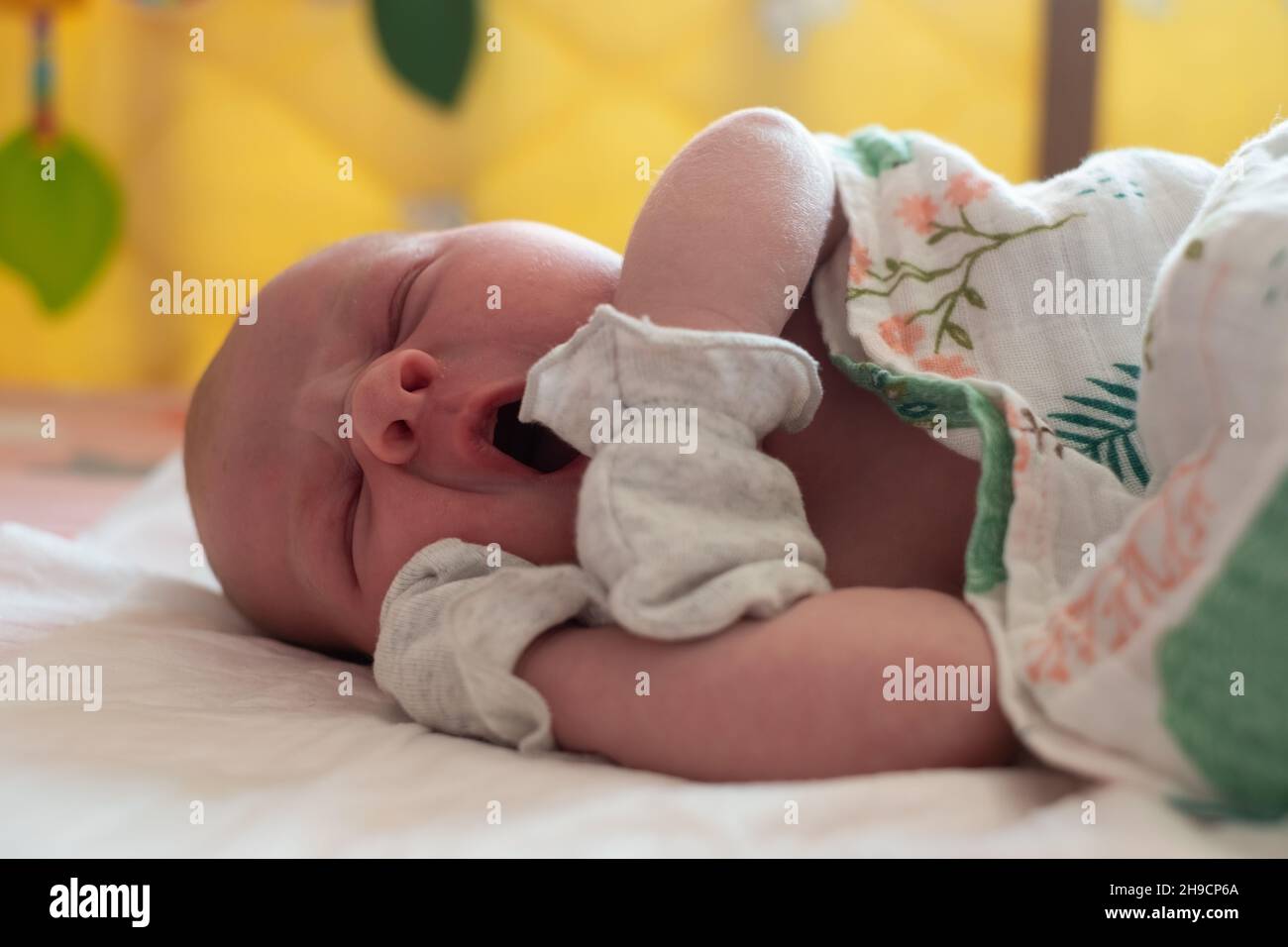 Adorable caucasian newborn baby sleeping in bed Stock Photo Alamy