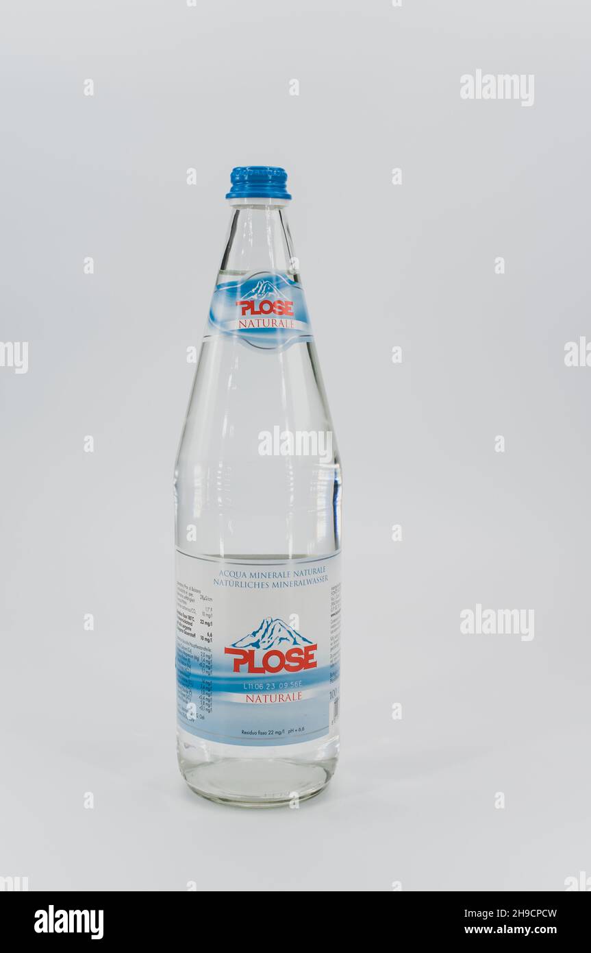 INVERIGO, ITALY - Dec 03, 2021: light natural water glass bottle on a ...