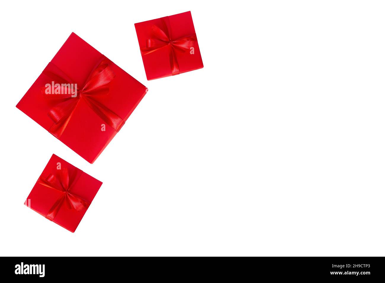 three red gift boxes on white background with copyspace Stock Photo