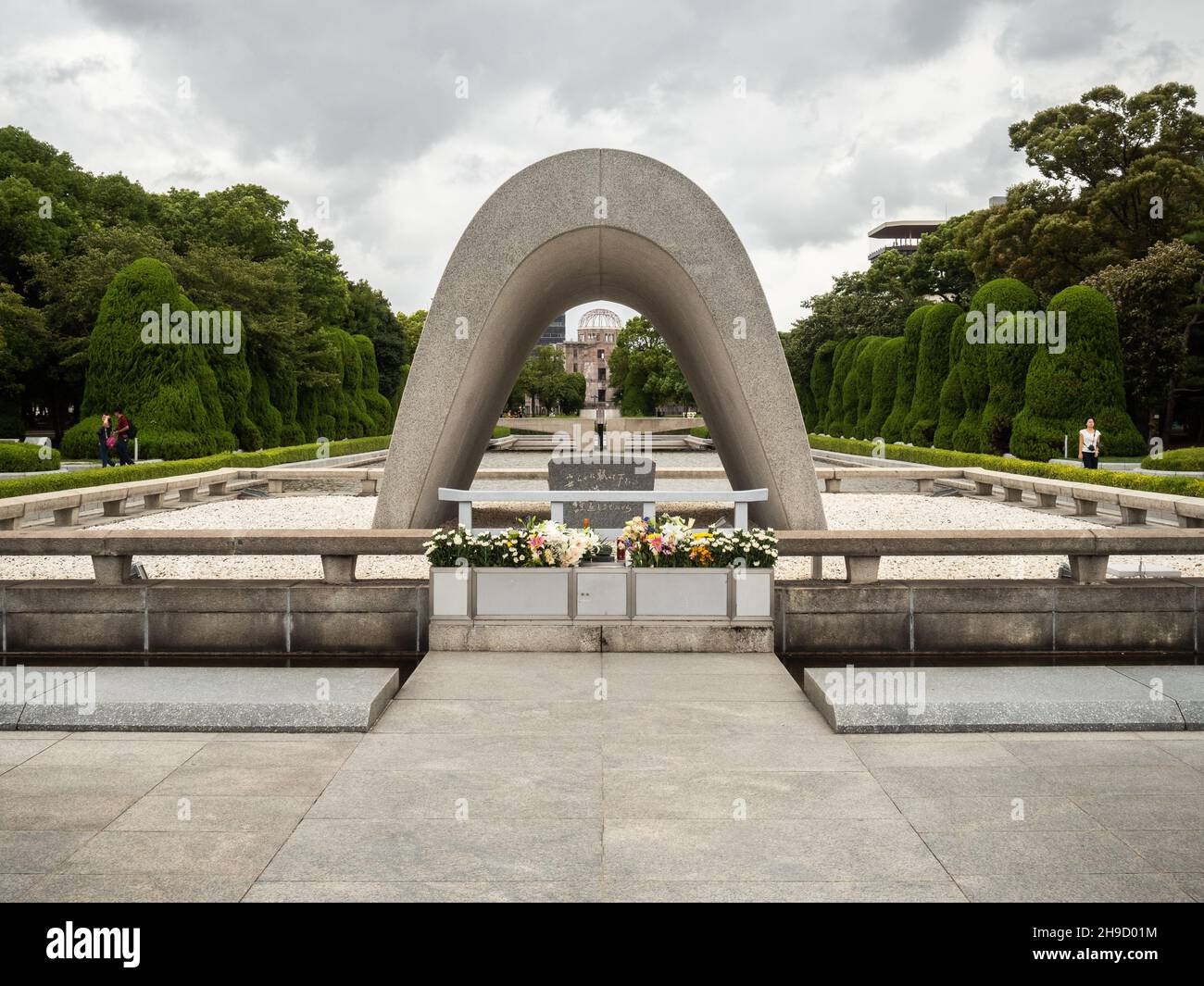 The Memorial Cenotaph to victims of the atomic bomb, Hiroshima, Japan. The Cenotaph bears the names of those who died in the bombing on 6 August 1945, Stock Photo