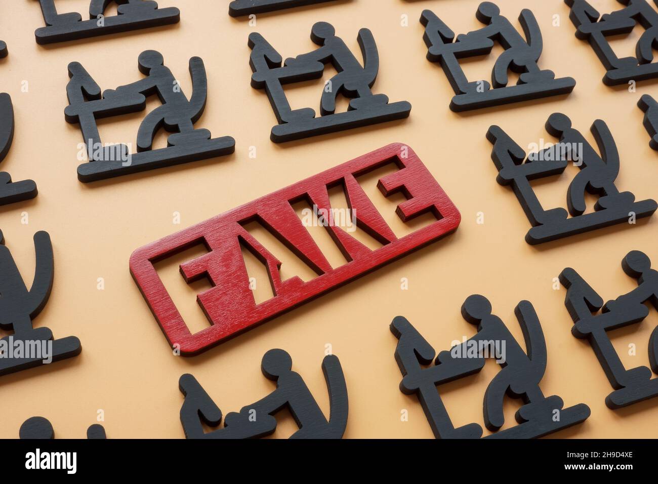 Internet disinformation concept. Word fake and figures as troll factory. Stock Photo
