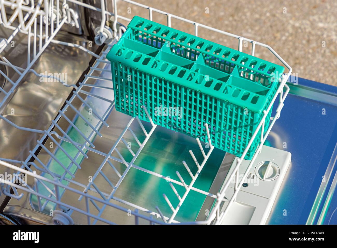 Lower Rack With Utensil Cutlery Holder at Small Dishwasher Stock Photo