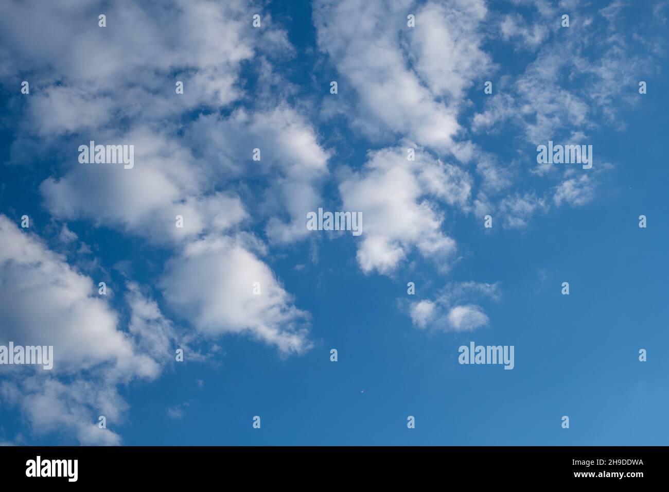 Modern building in a blue sky with clouds Stock Photo - Alamy