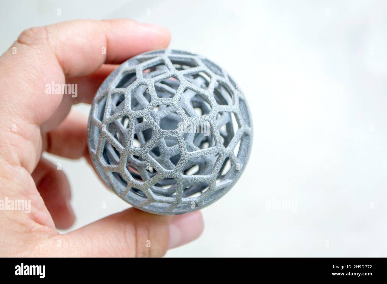 Man holding in hand model printed on 3D printer. Powder industrial 3D ...
