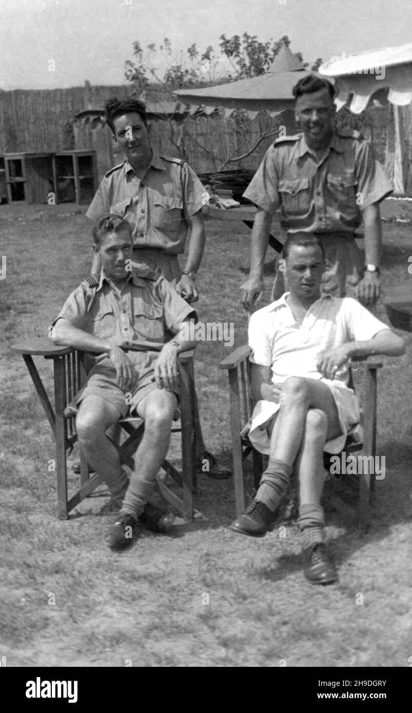 1946. RAF officers relaxing in the garden of the officers' mess at Accra Airport, Ghana / The Gold Coast. Stock Photo