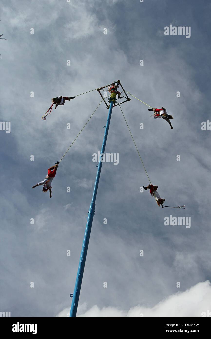Mexican ancient ritual of Voladores. Dance of the Flyers. Stock Photo