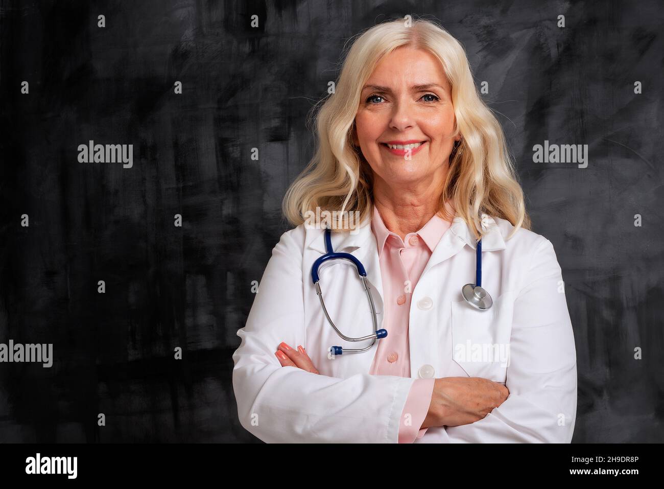 Female senior nurse arms crossed hi-res stock photography and images ...