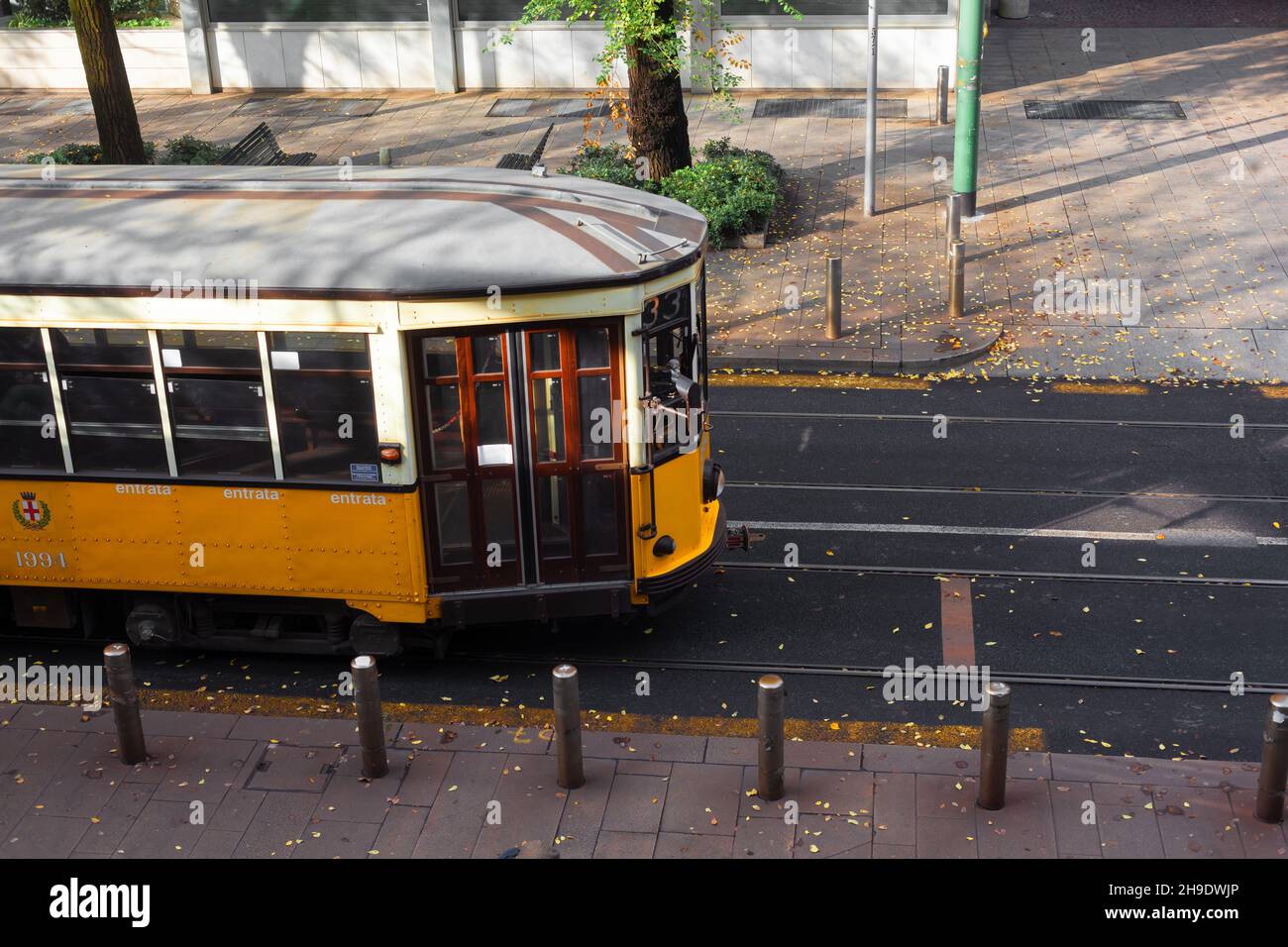 View of the old vintage orange tram on the street of Milan, Italy Stock Photo