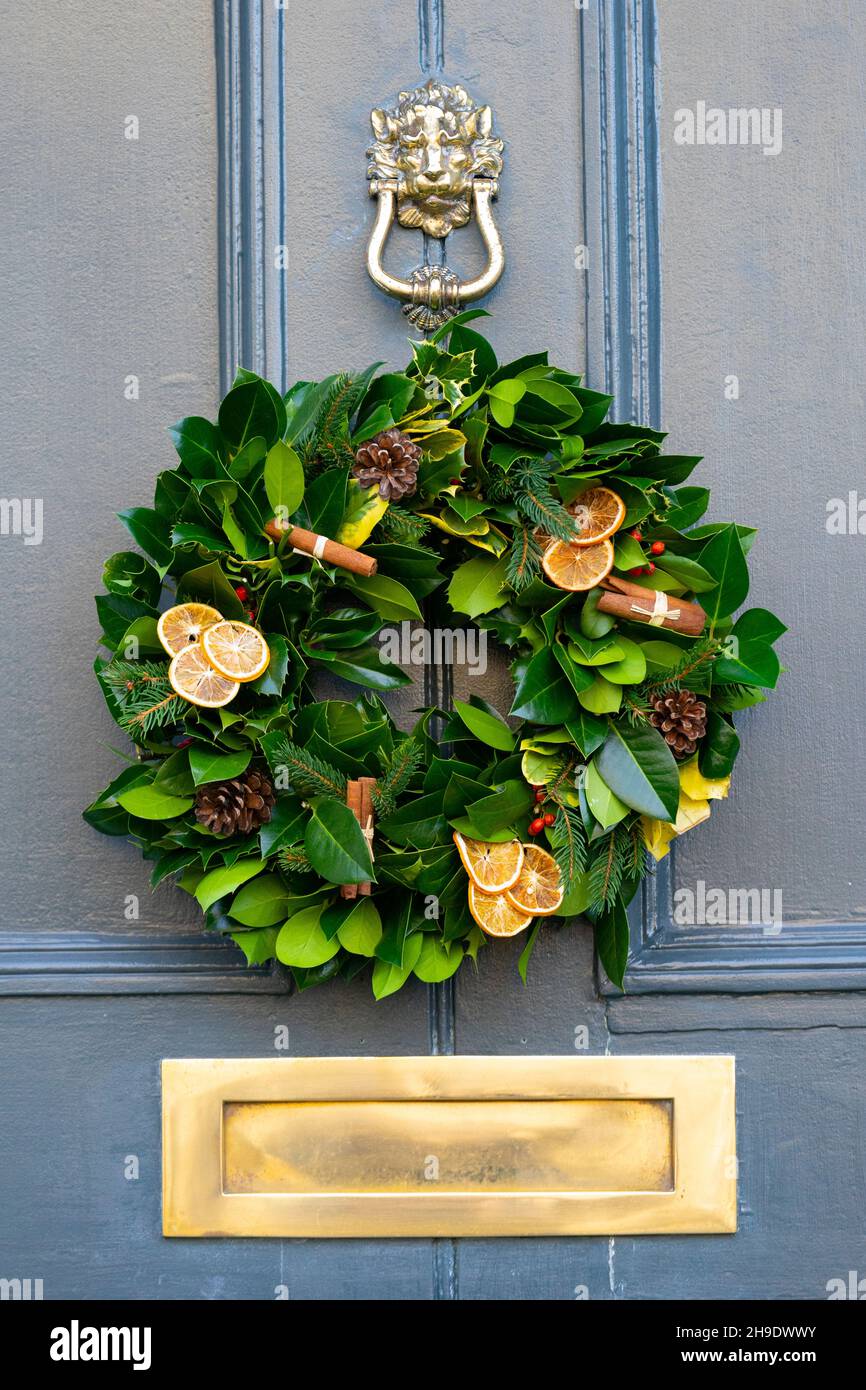 Traditional Christmas floral wreath on door of house in Edinburgh new Town, Scotland, UK Stock Photo