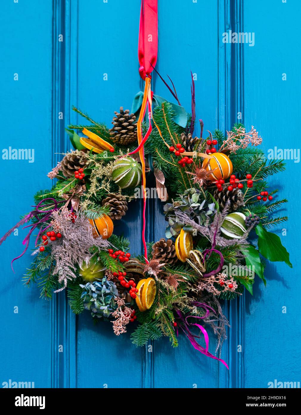 Traditional Christmas floral wreath on door of house in Edinburgh new Town, Scotland, UK Stock Photo