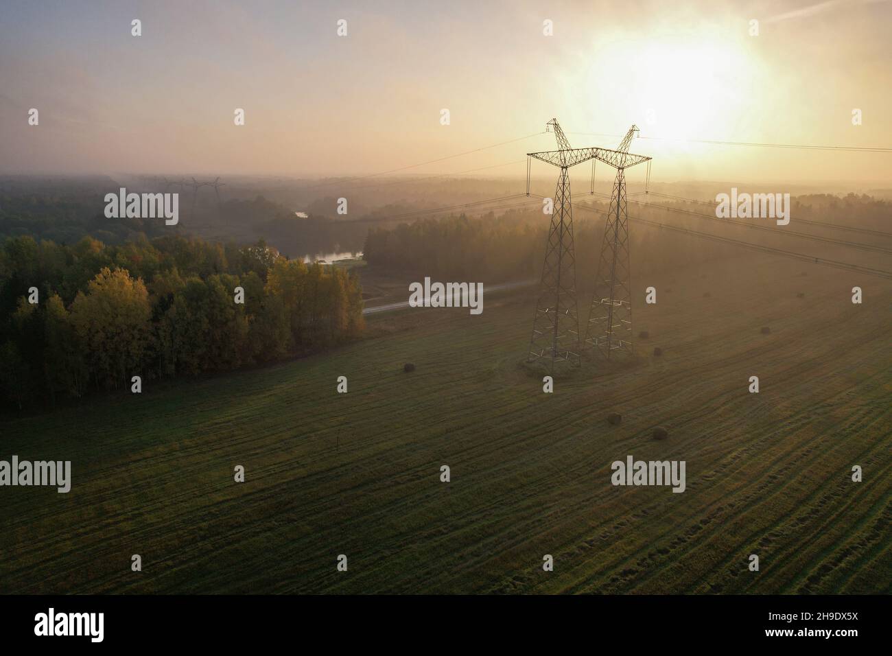 Power line in the countryside at dawn. Stock Photo