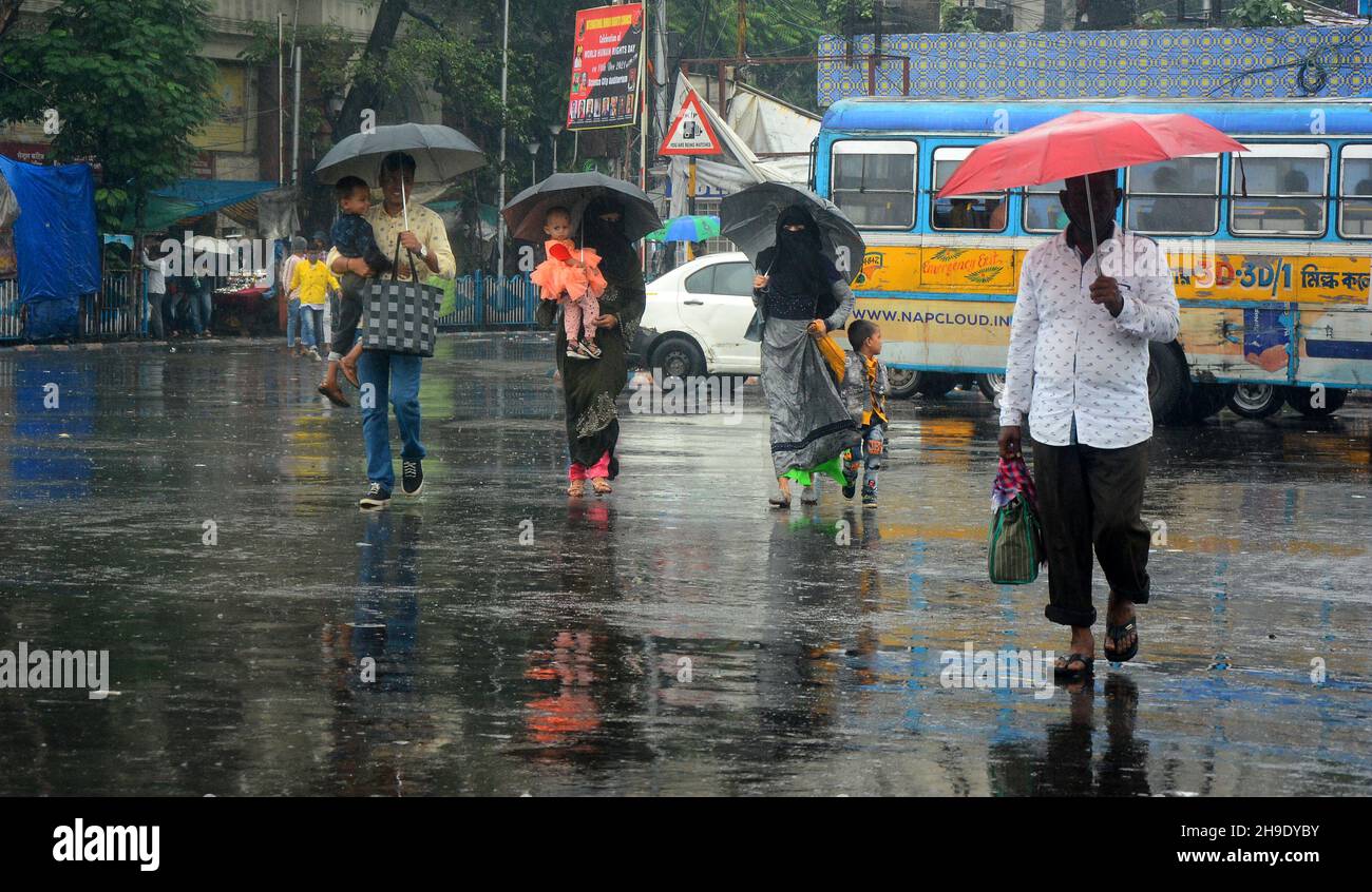 Kolkata, India. 05th Dec, 2021. Pedestrians face heavy rains during the  passage of Jawad Cyclone in Kolkata, India, on December 5, 2021. The India  Meteorological Department forecast that the cyclonic storm will