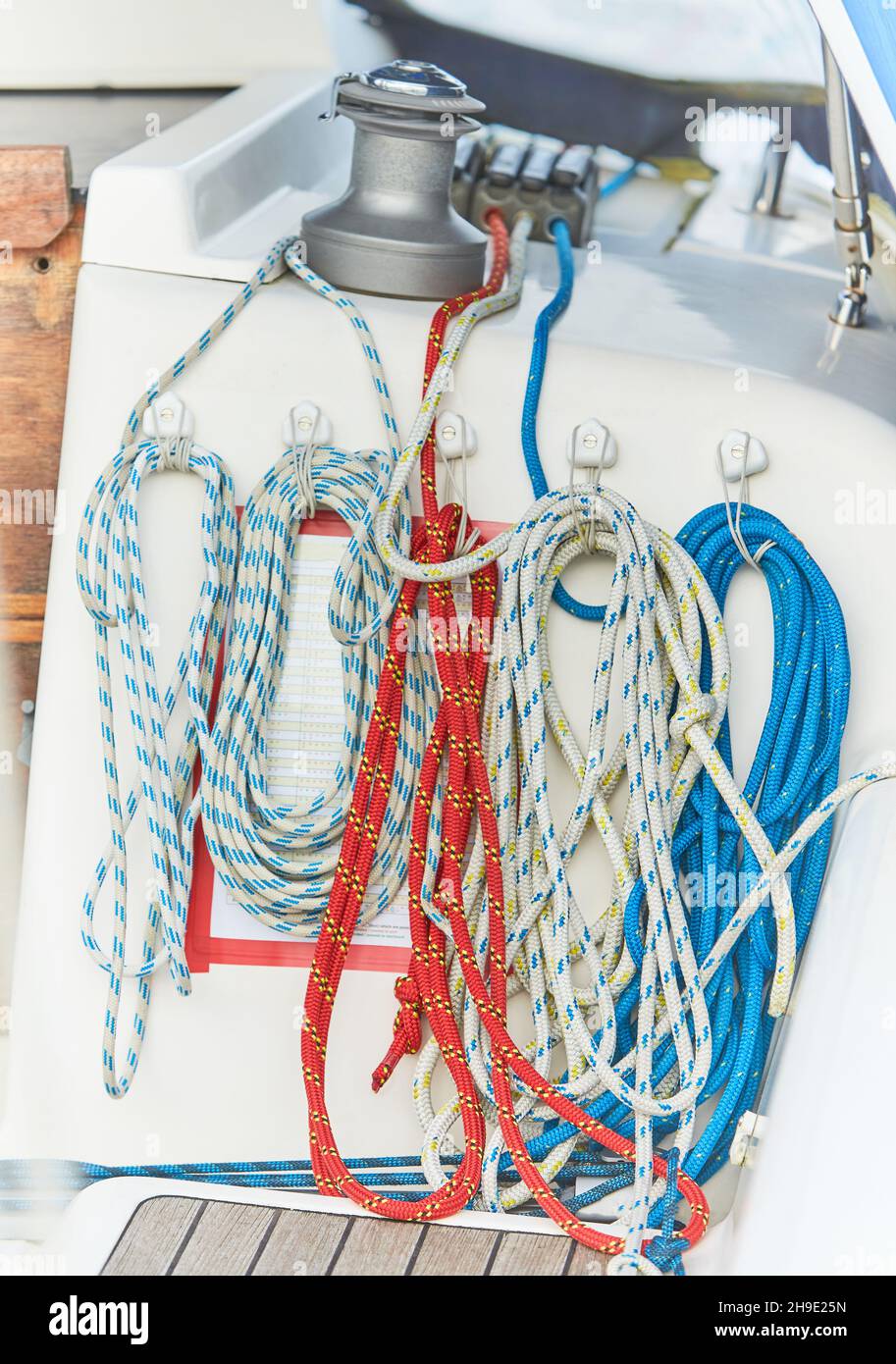 Winch and nautical ropes on a sailing boat in the port Stock Photo - Alamy